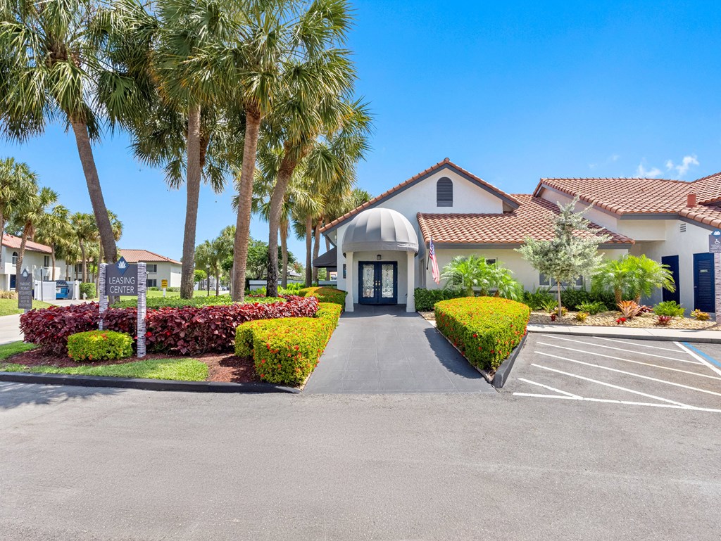 A building with a sign that says "LEISURE CENTER" in front of it.